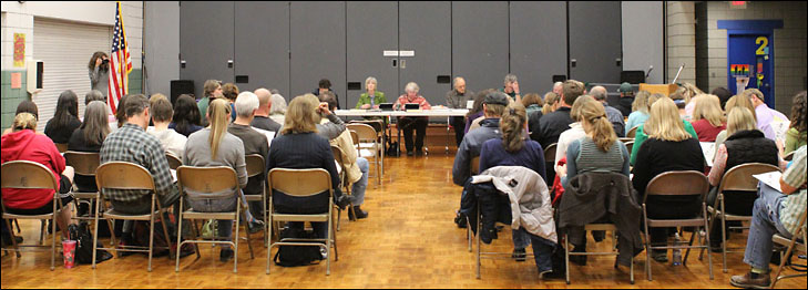 photo of audience at board meeting